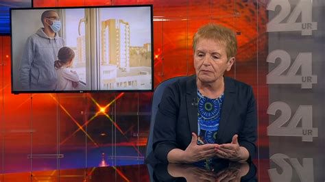 doječa mati s masko med epidemijo